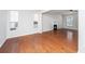 Large living room features hardwood floors, bright windows, and a neutral color palette at 137 St Phillips Row, Summerville, SC 29485