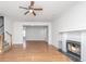 Spacious living room with hardwood floors, a traditional fireplace, and ample space for comfortable seating at 137 St Phillips Row, Summerville, SC 29485