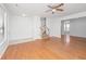 Open-concept living space with hardwood floors, a staircase, and an entryway leading to a welcoming atmosphere at 137 St Phillips Row, Summerville, SC 29485