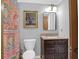 Clean bathroom featuring a granite topped vanity, framed mirror, and decorative shower curtain at 14 Town Park Ln # B, Charleston, SC 29412