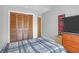 Bedroom featuring a wooden closet, wood-look flooring, and light gray colored walls at 14 Town Park Ln # B, Charleston, SC 29412