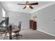 This bedroom is currently arranged as a functional office with neutral colors and ample storage at 14 Town Park Ln # B, Charleston, SC 29412