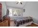 Cozy bedroom featuring a bay window, ceiling fan, and wood-look flooring for a warm ambiance at 14 Town Park Ln # B, Charleston, SC 29412