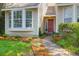 Inviting front entrance with a decorative door and lush landscaping along the walkway at 14 Town Park Ln # B, Charleston, SC 29412