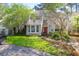 Charming home with a well-maintained lawn, mature landscaping, and a welcoming front entrance at 14 Town Park Ln # B, Charleston, SC 29412