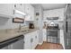 Well-lit kitchen features stainless steel appliances, sleek countertops, and ample cabinet space at 14 Town Park Ln # B, Charleston, SC 29412