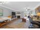 Cozy living room with fireplace, ceiling fan, and view of outdoor space at 14 Town Park Ln # B, Charleston, SC 29412