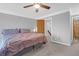 Bright main bedroom with a ceiling fan, soft carpet, and ensuite bathroom access at 14 Town Park Ln # B, Charleston, SC 29412