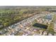 Aerial view showcases a well-planned community with pond, green spaces, and tree-lined streets at 1529 Fishbone Dr, Johns Island, SC 29455