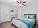 Bedroom with two large closets, a ceiling fan, and coastal themed pillows at 1529 Fishbone Dr, Johns Island, SC 29455