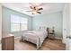 Bedroom with wood floors, ceiling fan, and a night stand with a lamp at 1529 Fishbone Dr, Johns Island, SC 29455