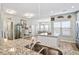 Bright and airy kitchen with an island, granite countertops, stainless steel appliances and views into the dining room at 1529 Fishbone Dr, Johns Island, SC 29455