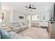 Spacious living room features hardwood floors, stylish decor, and seamless flow to adjacent dining and kitchen areas at 1529 Fishbone Dr, Johns Island, SC 29455