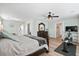 Large main bedroom featuring wood floors, ceiling fan, and exercise equipment at 1529 Fishbone Dr, Johns Island, SC 29455