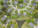 Aerial view of homes in a residential community with a pond and circular streets at 1537 Sweet Myrtle Cir, Mount Pleasant, SC 29466