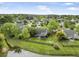 Aerial view of a single-Gathering home with a screened-in porch, large backyard and pond at 1537 Sweet Myrtle Cir, Mount Pleasant, SC 29466