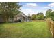 Large backyard with a covered patio and wooden fence at 1537 Sweet Myrtle Cir, Mount Pleasant, SC 29466