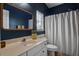 Bathroom with a white sink and vanity, blue walls, and modern fixtures and an inviting design at 1537 Sweet Myrtle Cir, Mount Pleasant, SC 29466
