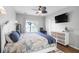 Bedroom featuring a plush bed, dresser, TV, and a view to the backyard at 1537 Sweet Myrtle Cir, Mount Pleasant, SC 29466