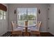 Cozy breakfast nook with a round table, wicker chairs, and a window with natural light at 1537 Sweet Myrtle Cir, Mount Pleasant, SC 29466