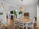 Bright dining area with a round table and a view of the living room at 1537 Sweet Myrtle Cir, Mount Pleasant, SC 29466