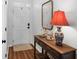 Welcoming foyer featuring a wooden console table and a stylish lamp at 1537 Sweet Myrtle Cir, Mount Pleasant, SC 29466