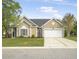 Charming single-story home with a well-manicured lawn and a two-car garage at 1537 Sweet Myrtle Cir, Mount Pleasant, SC 29466