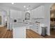 Bright kitchen with white cabinetry, countertops, and stainless steel appliances on hardwood floors at 1537 Sweet Myrtle Cir, Mount Pleasant, SC 29466