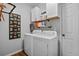 Clean laundry room with washer, dryer, cabinet storage and modern fixtures at 1537 Sweet Myrtle Cir, Mount Pleasant, SC 29466