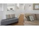 Cozy living space featuring a gray sofa, a bench, and hardwood floors at 1537 Sweet Myrtle Cir, Mount Pleasant, SC 29466