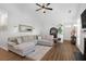 Bright living room with a comfortable sectional sofa and hardwood floors at 1537 Sweet Myrtle Cir, Mount Pleasant, SC 29466