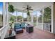 Enjoy the outdoors in this lovely screened porch, featuring lounge seating and an outdoor fireplace at 1537 Sweet Myrtle Cir, Mount Pleasant, SC 29466