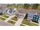 Aerial view showcasing multiple homes and well-manicured lawns in a residential neighborhood at 154 Calm Water Way, Summerville, SC 29486