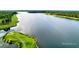 Expansive aerial shot of the serene lake, surrounded by lush green landscapes at 154 Calm Water Way, Summerville, SC 29486