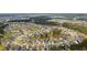 A picturesque aerial view shows a well-planned community surrounded by lush greenery and bodies of water at 154 Calm Water Way, Summerville, SC 29486