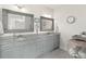 Bright bathroom with double sinks, granite countertops, and decorative mirrors at 154 Calm Water Way, Summerville, SC 29486