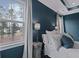 Serene primary bedroom featuring soft bedding, neutral tones, and a view of the outdoors at 154 Calm Water Way, Summerville, SC 29486