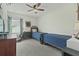 Comfortable bedroom with twin beds, ceiling fan, and neutral carpeting at 154 Calm Water Way, Summerville, SC 29486