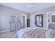 Cozy bedroom featuring a large dresser, a mirror, and a glimpse into the attached bathroom at 154 Calm Water Way, Summerville, SC 29486