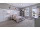 Bedroom with wainscotting, neutral decor and furniture and plush carpet at 154 Calm Water Way, Summerville, SC 29486