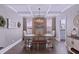 Elegant dining room showcasing decorative trim, natural light, and a stylish chandelier at 154 Calm Water Way, Summerville, SC 29486