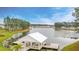 Picturesque lake view featuring a private covered dock and tranquil waterside community at 154 Calm Water Way, Summerville, SC 29486