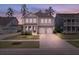 Gorgeous home with beautiful curb appeal, two-car garage, and a cozy front porch at 154 Calm Water Way, Summerville, SC 29486