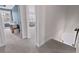 Upstairs hallway that showcases two entryways and neutral carpet floors throughout at 154 Calm Water Way, Summerville, SC 29486