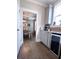 Hallway includes a wet bar with gray cabinets, countertops, and stainless steel wine cooler at 154 Calm Water Way, Summerville, SC 29486