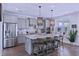Spacious kitchen features an island, stainless appliances, and natural light at 154 Calm Water Way, Summerville, SC 29486