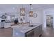 Spacious kitchen island with marble countertops and sink, perfect for cooking and entertaining at 154 Calm Water Way, Summerville, SC 29486