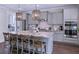 Well-equipped kitchen with stainless appliances, marble countertops, and pendant lighting at 154 Calm Water Way, Summerville, SC 29486