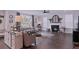 Cozy living room with fireplace, shiplap wall, comfortable seating, and plenty of natural light at 154 Calm Water Way, Summerville, SC 29486