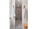 Modern walk-in shower featuring horizontal tiling, a built-in seat, and overhead lighting at 154 Calm Water Way, Summerville, SC 29486